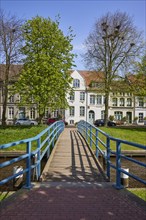 Houses and bridge over the Mittelburggraben in Friedrichstadt, Nordfriesland district,