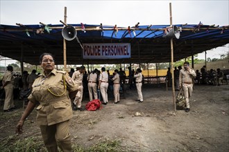 Barpeta, India. 6 May 2024. Police personnels arrives with luggage to leave for allocated polling
