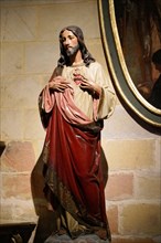 The Iglesia de San Anton church on the Nervion river in Bilbao, A statue of Jesus showing the heart