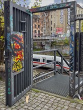 Germany, Berlin, 26.04.2024, S-Bahn ring railway trench, open service gate, ICE, view to