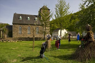 Scarecrows at the Protestant church in Unterburg, Solingen, Bergisches Land, North Rhine-Westphalia