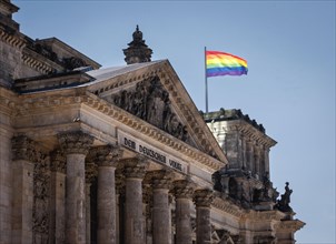 Rainbow flags fly at the Reichstag building to mark the International Day against Homo-, Bi-,