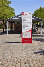 Signposts to various institutions and museums at the bus station in Niebuell, Nordfriesland