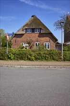Side view of a Frisian house in Niebuell, Nordfriesland district, Schleswig-Holstein, Germany,