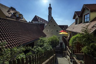 Alley in the old town of Landsberg am Lech, behind the church tower of the parish church Mariae