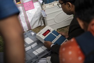 Barpeta, India. 6 May 2024. Polling officials check Electronic Voting Machines (EVMs) before