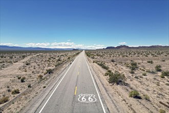Drone shot of Route 66 with Route 66 sign on the road, Mojave Desert, California
