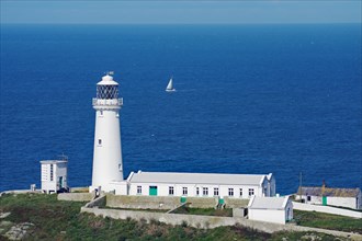 The South Stack Lighthouse and a sailing boat, Stevenson family, Holyhead, Wales, Great Britain