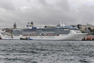 Cruise ship ISLAND PRINCESS, A white cruise ship against the historic backdrop of the Galata Tower