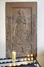 Epitaph, relief with sacrificial candles, woman's gestures, former monastery church of St. Peter