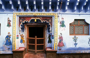 Entrance of a house decorated with traditional mural paintings, Rajasthan, India, Asia