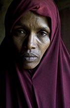 Portrait of a muslim woman whose husband drowned in the Mediterranean sea while trying to migrate