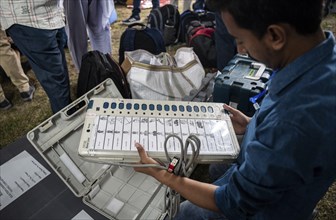 Barpeta, India. 6 May 2024. Polling officials check Electronic Voting Machines (EVMs) before