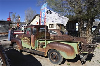 Old, rusty cars in the backyard of Delgadillo's Snow Cap Drive Inn on Route 66, Seligman, Arizona