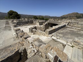 View of foundation walls of in antiquity former storehouse with storerooms workshops building for
