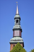 Spire of St Laurentius Church in Toenning, North Friesland district, Schleswig-Holstein, Germany,