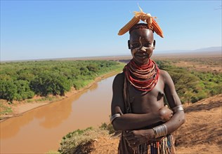 Southern Ethiopia, Omo region, Omo river landscape, proud woman of the Karo people with headdress,