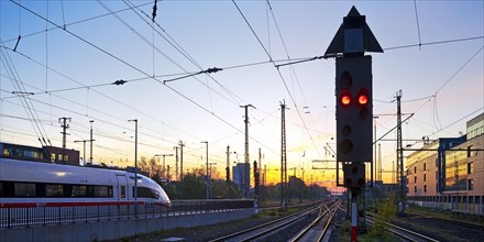 Intercity-Express at the atmospheric sunrise at the main railway station in Dortmund, Germany,