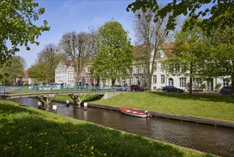 Houses and bridge over the Mittelburggraben in Friedrichstadt, Nordfriesland district,