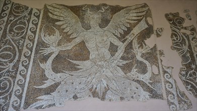 Antique mosaic of a winged creature, sea god Triton, damaged, shows detailed mythological