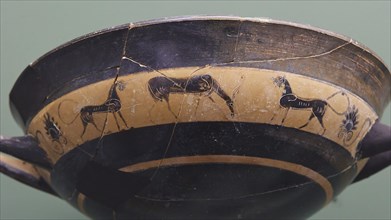 Old black bowl with animal drawings on a greenish background, interiors, Archaeological Museum, Old