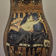 Antique Greek vase with picture of lovers in an intimate embrace, dog under the table, interiors,