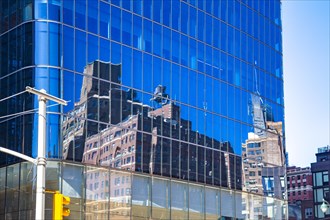 Historic buildings are reflected in the skyscraper 30 Hudson Yards, Manhattan, New York City