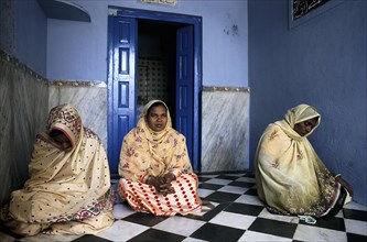 Muslim women praying at the Moinuddin Chishti mausoleum, dargah sharif at Ajmer, Rajasthan, India.