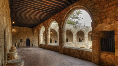 HDR image, Arcades of a stone monastery with medieval architecture, illuminated by sunlight,