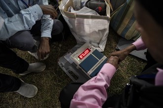 Barpeta, India. 6 May 2024. Polling officials check Electronic Voting Machines (EVMs) before