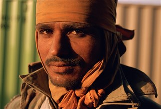 Portrait of a worker, man loading and unloading sacks, India, Asia