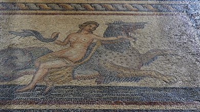 Antique mosaic of a mythological figure on a mythical creature, a nereid riding a hippocampus,