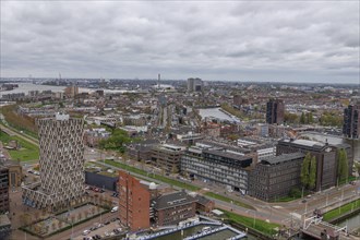 Aerial view of a city with modern and old buildings along a river, hustle and bustle, view from