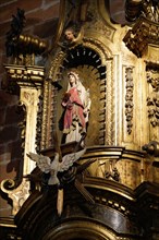 The Iglesia de San Anton church on the Nervion river in Bilbao, A religious statue on an ornate