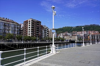On the road in Bilbao, Bizkaia province, Basque Country, Spain, Europe, River bank with buildings