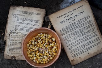 Orthodox christian books written in geez language, maize dish, food eaten by a family in Tigray
