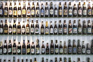 Various beer bottles from German beer producers are displayed at a stand of German brewers at the