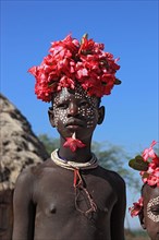 South Ethiopia, Omo region, tribal members of the Karo people, with floral decorations and body