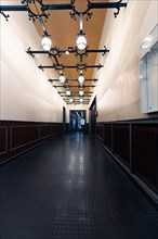 Historic hallway with dark floor and decorative lighting, Berlin, Tempelhof, Germany, Europe