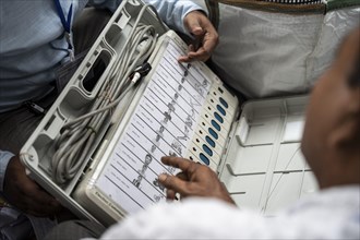 Barpeta, India. 6 May 2024. Polling officials check Electronic Voting Machines (EVMs) before