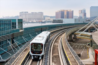 Driverless train Macao Light Rapid Transit at the airport public transport stop in Macau, China,