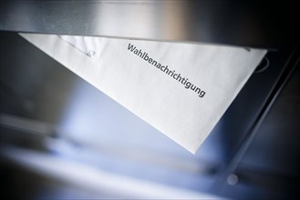 Symbolic photo: A polling card lying in a letterbox. Berlin, 14 May 2024