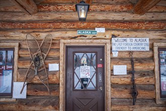 Entrance of a souvenir shop, log cabin, frontal, Alaska, USA, North America
