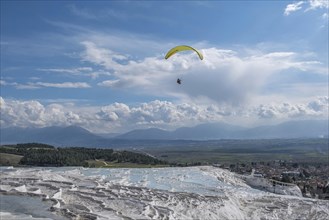 Sintered limestone terraces of Pamukkale, tandem paragliding, Pamukkale, Denizli province, Aegean