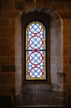 The Iglesia de San Anton church on the Nervion river in Bilbao, A colourful church window with