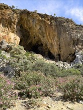 View of large natural grotto cave in Agiofarago Gorge of the Saints on south coast of island of