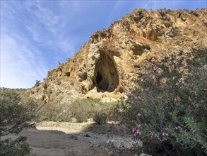 View of large natural grotto cave A Muerte in Agiofarago gorge of the saints on south coast of