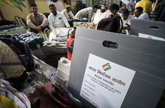 Barpeta, India. 6 May 2024. Polling officials collects Electronic Voting Machines (EVMs) and Voter