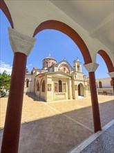 View through archway to main entrance portal of orthodox church monastery church Zoodochos Pege in