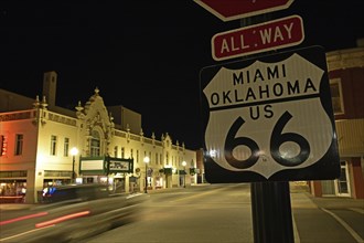 Night shot of illuminated main road with street ski, Route 66, Miami, Oklahoma